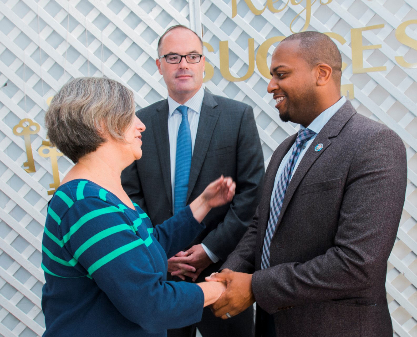 Administrative Internship program members shaking hands