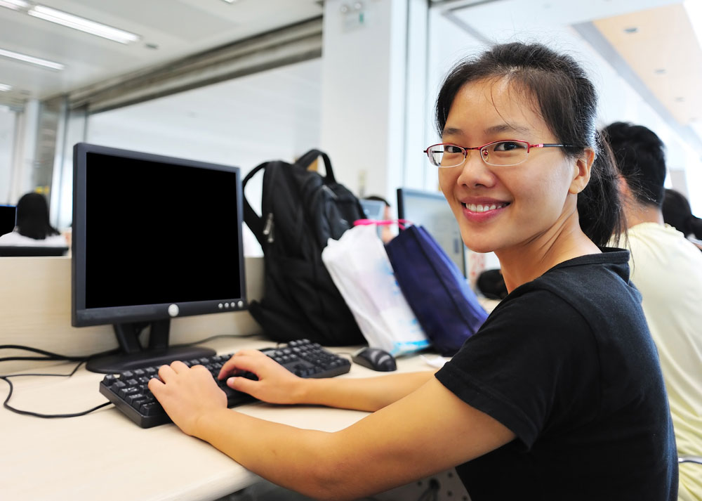 young women on desktop computer