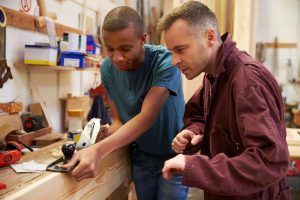 Two carpenters working together