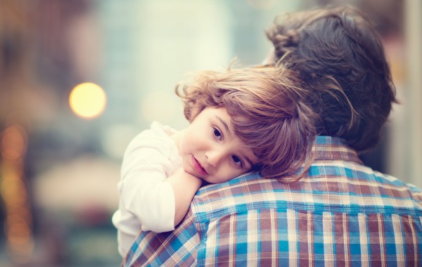 father holding daughter