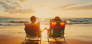 couple holding hands on the beach
