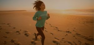 women running on the beach background